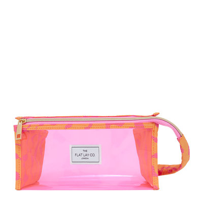 The Flat Lay Co. Makeup Perspex Box Bag in Pink Dribbles on Orange